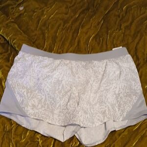 Under Armour Active wear shorts with an elastic band and the white pantyliner